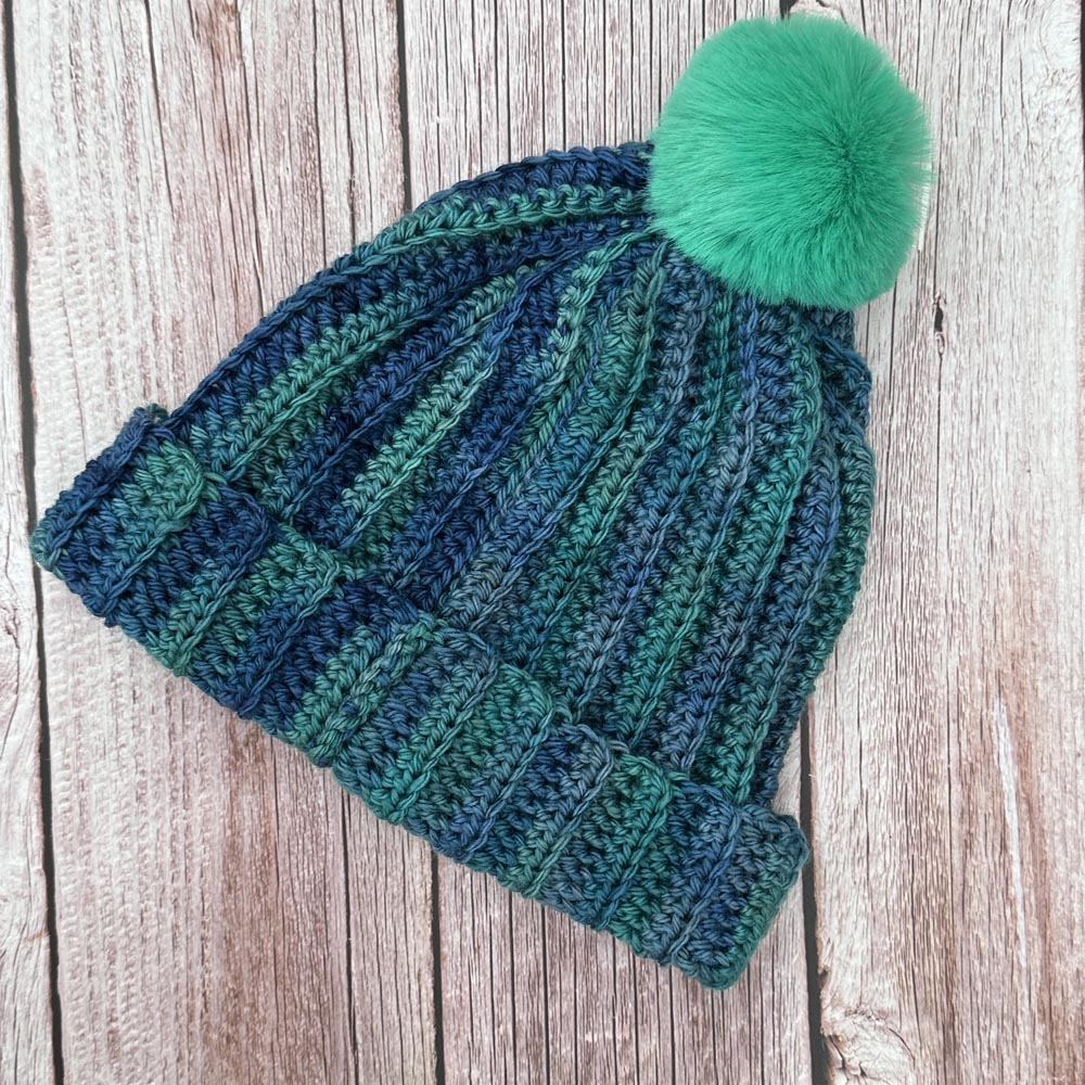 ribbed hat with jade green pompom
