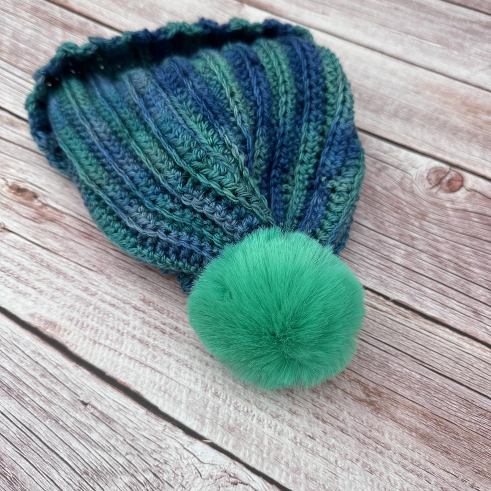 ribbed hat with jade green pompom