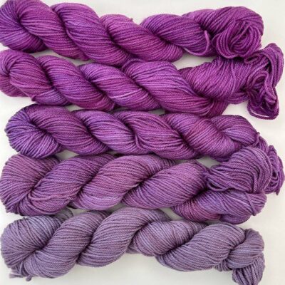 Amethyst Dream gradient yarn pack transitioning from light violet to rich purple.