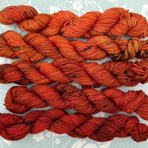 Autumn Blaze gradient yarn pack transitioning from burnt orange to vivid red-orange.