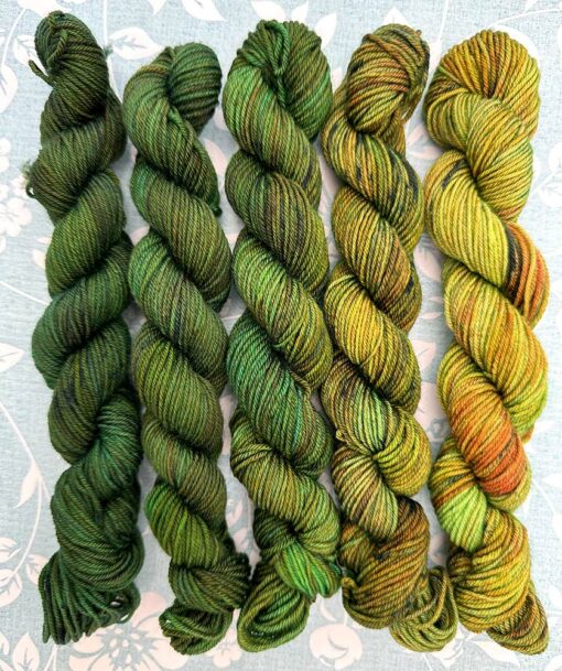 Meadow Walk gradient yarn pack transitioning from bright yellow-green to rich forest green.