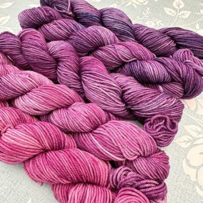 Petal Fade gradient yarn pack transitioning from rosy pink to vibrant violet.